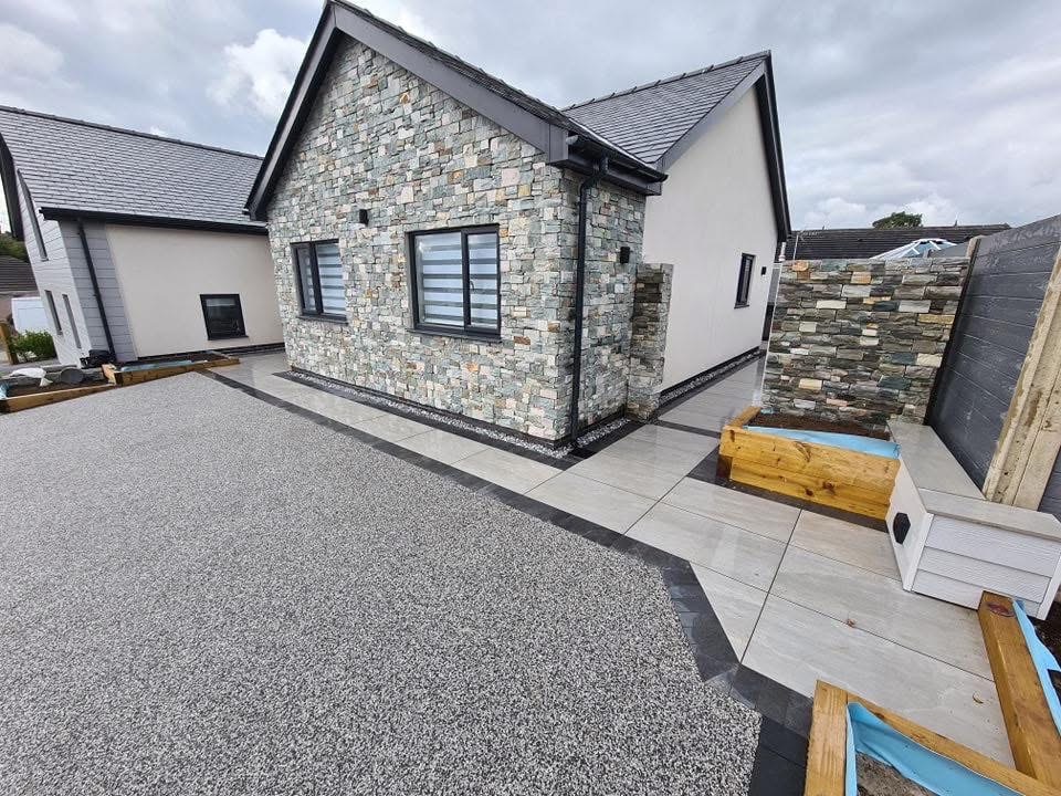 Modern porcelain patio installed in North Wales at golden hour